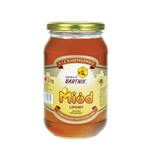 Miód lipowy 1,2 kg - Sądecki Bartnik. Przezroczysty słoik z żółtą zawartością oraz złotą zakrętką. Etykieta jest w kolorze jasno żółtym. Etykieta zawiera logo, nazwę, producenta, pojemność oraz skład.