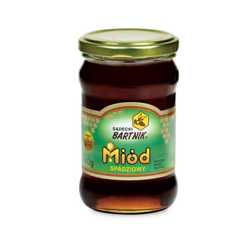 Miód spadziowy 0,4 kg - Sądecki Bartnik. Przezroczysty słoik z ciemną zawartością oraz złotą zakrętką. Etykieta jest w kolorze ciemno zielonym.  Etykieta zawiera logo, nazwę, producenta, pojemność oraz skład.