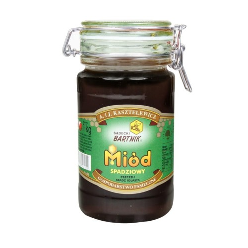 Miód Gryczany Komfort - Sądecki Bartnik  o pojemności 1 kg. Ciemno brązowy miód w przezroczystym słoiku z pokrywką zamykaną na klamrę. Słoik posiada zieloną etykietę , na której są podstawowe informacje: nazwa, producent, waga, kraj.