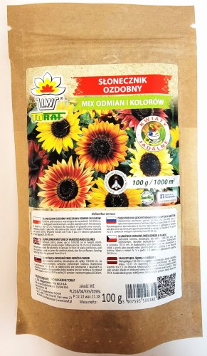 Słonecznik ozdobny. Zapakowany w opakowanie 100 gramowe w naturalnym brązowym kolorze z etykietą z kolorowymi słonecznikami zwierającą nazwę producenta oraz tłumaczenie w 6 językach.