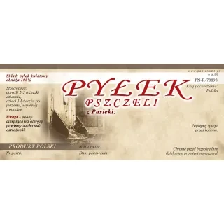 Prostokątna etykieta w kolorze jasno brązowym z ciemniejszym paskiem na górze. Na etykiecie jest czerwony napis pyłek kwiatowy, po lewej stronie jest zdjęcie wlotka z pszczołami. Na etykiecie informacje do uzupełnienia.